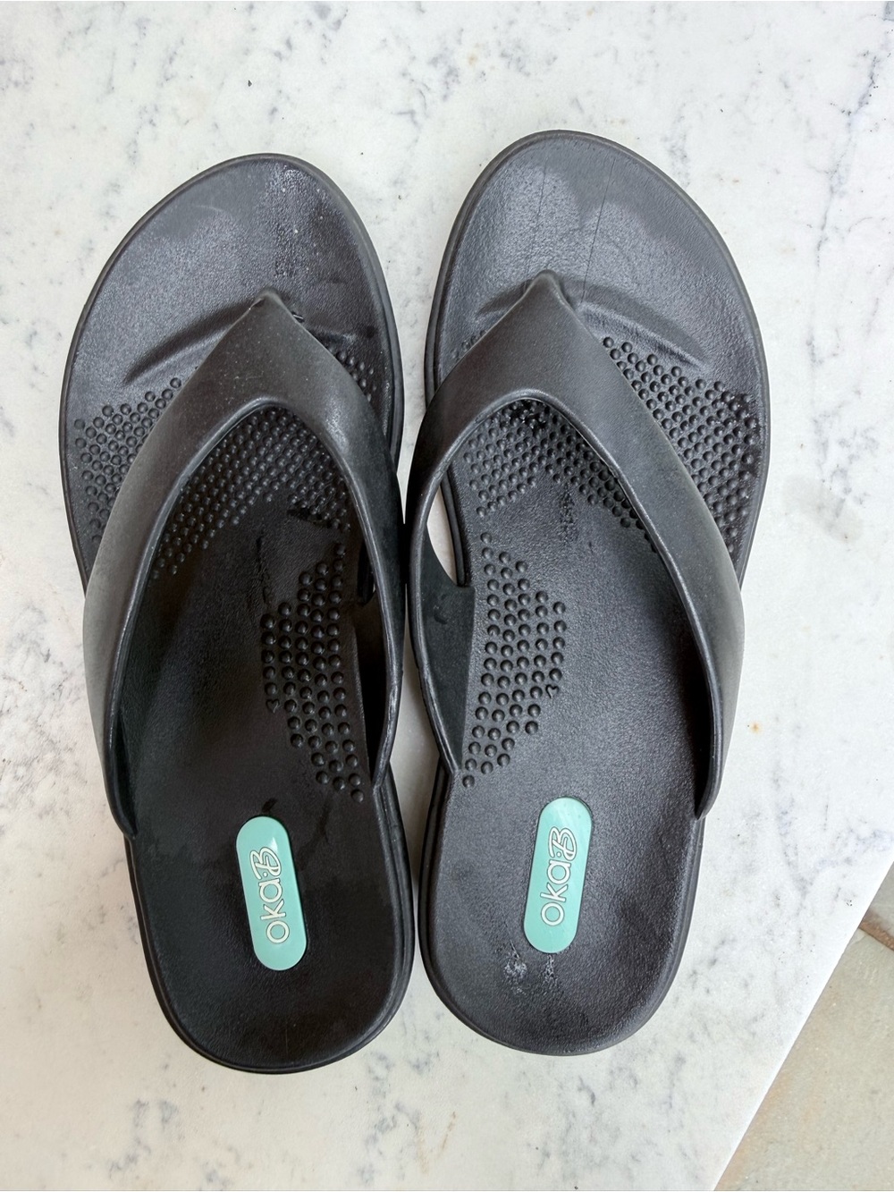 OKA b. Black Foam Thong Sandals with Mint Logo Accent